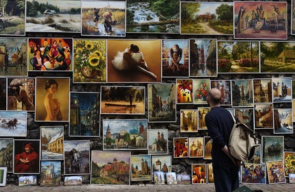 Poland, Lesser Poland region, Krakow, old town (Stare Miasto), paintings of amateurs painters hung on the walls of the Piariste street