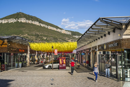 France, Aveyron, Millau, La Capelle shopping center in the city center, the Puncho d'Agast in the background