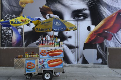 United States, New York, Manhattan, Meatpacking district (Gansevoort Market), Street Food Vendor of hot-dog and advertising poster