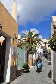 Italy, Sicily, Aeolian Islands, listed as World Heritage by UNESCO, Stromboli island, scooter in the main street of the village of Stromboli