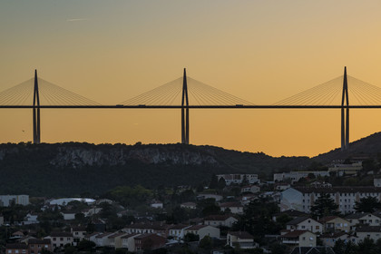 France, Aveyron, Grands Causses regional natural park, Millau city and the Millau viaduct by architects Michel Virlogeux and Norman Foster in the background
