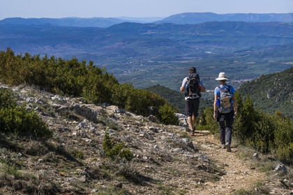 France, Herault, the Causses and the Cevennes, Mediterranean agro pastoral cultural landscape, listed as World Heritage by UNESCO, Saint Privat, hikers on the path from Mont Saint Baudille towards Saint-Guilhem-le-Désert