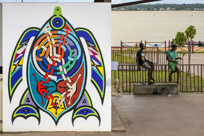 France, French Guiana, Saint-Laurent-du-Maroni, the redeveloped riverbanks of the La Charbonnière district, with its Bushinengue roots, feature new colorful kiosks adorned with original Tembé artwork created by artists Francky Amété and Carlos Adaoudé
