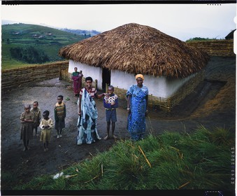Burundi, Bujumbura Province, Ijenda area, Tutsi family in the main courtyard of the rugo (traditional farm) (4x5 reversal film reproduction)