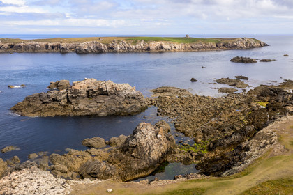 France, Finistère, Iroise Sea, Ouessant Island, Keller Island separated from the north coast by the channel named Penn ar Ru Meur where there is a strong sea current (aerial view)