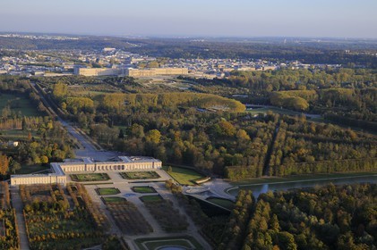 France, Yvelines, Chateau de Versailles Park, listed as World Heritage by UNESCO, the Grand Trianon in the foreground and the castle in the background (aerial view)