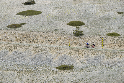 France, Vaucluse, Parc Naturel Regional du Mont Ventoux, Bedoin, bike ascent of Mont Ventoux by the D974 road on the southern slope towards the summit, scree covered here and there with dwarf junipers