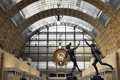 France, Paris, Orsay museum, sculpture A find in Pompei (1863) by Hippolyte Moulin on the left and sculpture Victor in Cockfight (1864) by Alexandre Falguière on the right