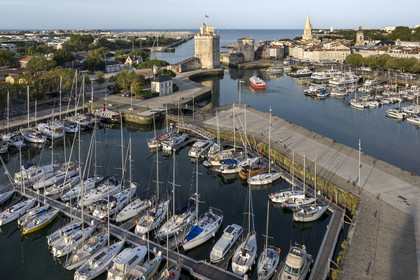 France, Charente Maritime, La Rochelle, the Old Port, Tour Saint Nicolas and Tour de la Chaine protect the entrance to the Old Port, the tour de la Lanterne in the background (aerial view)