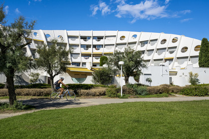 France, Herault, La Grande-Motte, labeled 20th century heritage, Couchant (setting sun) district west of the port, Le Calypso building by architect T. Fayeton and belonging to the female architectural style conches of Venus