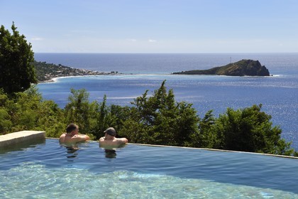 Caribbean, Dominica Island, Soufriere Bay, Soufriere, Jungle Bay hotel overflowing swimming pool