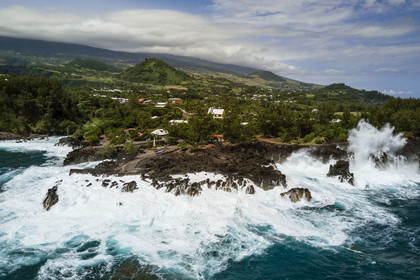 France, Reunion island (French overseas department), Saint-Joseph, the small port of the Marine de Langevin in a natural corridor of basalt rock from an old lava flow which allowed the installation of a landing stage (aerial view)