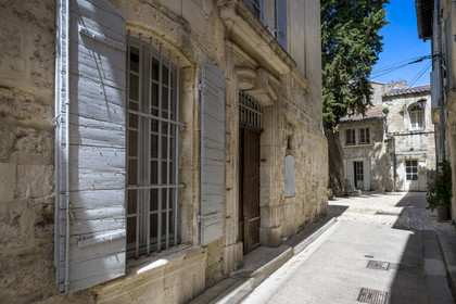 France, Bouches du Rhone, Tarascon, ols town street leading to the small Ernest Renan square