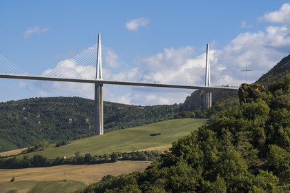 France, Aveyron, Grands Causses regional natural park, Peyre, the Millau viaduct by architects Michel Virlogeux and Norman Foster, above the Tarn river, the Cross of Peyre in the foreground
