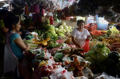 Nicaragua, Granada, central Market, fruits and vegetables saleswoman