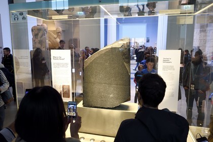 United Kingdom, London, Bloomsbury area, the British Museum, Ancient Egypt, the Rosetta Stone, engraved stela fragment of ancient Egypt bearing three versions (hieroglyphs, Egyptian demotic and Greek alphabet) of the same text that allowed the deciphering of hieroglyphs in the 19th century by Jean-François Champollion