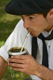 Argentina, Buenos Aires Province, San Antonio de Areco, estancia La Bamba de Areco, gaucho drinking Mate beverage (local herbal tea)