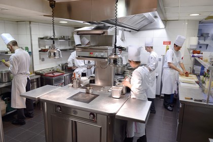 France, Rhone, Lyon, restaurant La Mère Brazier founded in 1921 by Eugenie Brazier, the Mathieu Viannay two Michelin stars Chef kitchen brigade at work