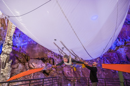 France, Gard, Mejannes-le-Clap, grotte de La Salamandre (Salamander cave), discovery of the cave in Aéroplume®, an individual dirigible balloon inflated with helium which allows you to fly away by flapping your wings