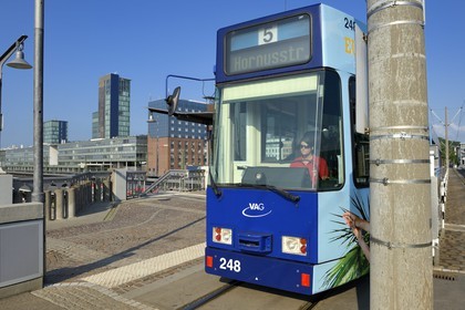 Germany, Baden-Wurttemberg, Freiburg im Breisgau, tram at Central Station and solar tower