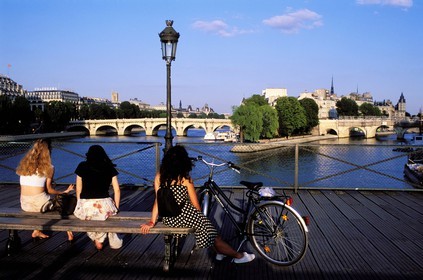 France, Paris, having a break on the Pont des Arts bridge, view of the Pont Neuf (New bridge)