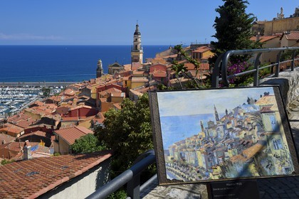 France, Alpes-Maritimes, Menton, old town dominated by the St Michel Basilica and reproduction of a painting of Maurice Frido