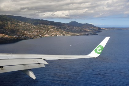 Portugal, Madeira Island, Madeira Cristiano-Ronaldo International Airport which has a 2781m runway extended over the sea thanks to pillars (aerial view)
