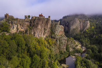 France, Haute Loire, Loire river Valley, Arlempdes, labelized the Most Beautiful Villages of France, ruins of the castle perched on a basalt rock (volcanic dyke) overlooking a Loire river meander (aerial view)