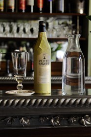 France, Val d'Oise, Auvers sur Oise, Ravoux inn where Van Gogh lived just before his death, the dining room on the ground floor, absinthe set including the bottle, a slotted spoon for sugar and a glass