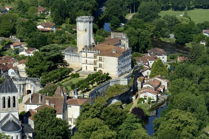 France, Dordogne, Perigord Vert, Bourdeilles, the castle overlooking the village and the Dronne river (aerial view)