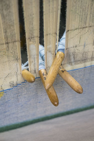 France, Herault, Lodève, Manufacture de la Savonnerie (Savonnerie manufactory) unique annex of the National Carpet Factory of the Savonnerie des Gobelins in Paris, work of a weaver on a loom, tapestry brooches
