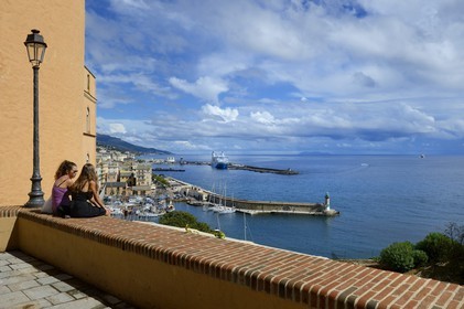 France, Haute Corse, Bastia, the Citadel district of Terra Nova, harbor view from the place du Donjon and the Isle of Capraia of the Tuscan archipelago in the background