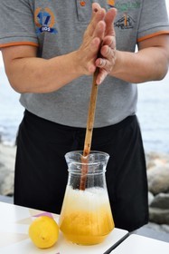 Portugal, Madeira Island, Porto da Cruz, preparation of the typical drink of the archipelago, poncha is an alcoholic cocktail made from brandy, sugar cane, lemon, orange or passion fruit juice