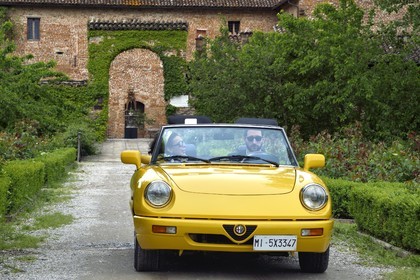 Italy, Emilia Romagna, Polesine Zibello near Parma, Antica Corte Pallavicina Hotel and restaurant, Alfa Romeo Duetto Spider yellow cabriolet