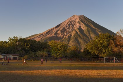 Nicaragua, Ometepe Island in Lake Nicaragua, football game under the Conception volcano (1610 m) still active