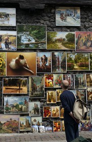 Poland, Lesser Poland region, Krakow, old town (Stare Miasto), paintings of amateurs painters hung on the walls of the Piariste street