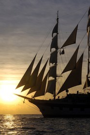 Caribbean sea, Saint Lucia island, the five masted ship SPV Royal Clipper with every sail set at sunset