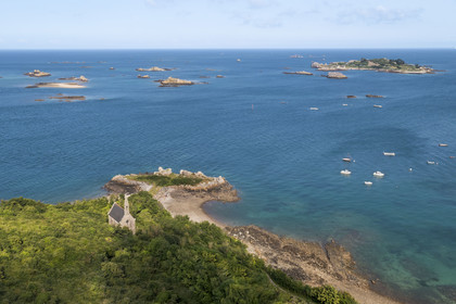 France, Cotes d'Armor, Ploubazlanec, chapel and Pointe de la Trinité, in the background the Island of Saint-Riom and the multiple rocks that surround it (aerial view)