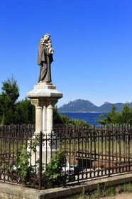 France, Alpes-Maritimes, Lerins Islands, Saint-Honorat island, Saint-Antoine statue and the Esterel Mountains in the background