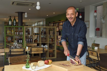 France, Corse du Sud, Prunelli river valley, Bastelica, Boutique Hotel Artemisia, its director Christophe Gandon taste a country ham together with local produce, apple, goat and sheep cheese
