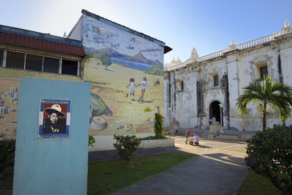 Nicaragua, Leon, Heroes and Martyrs Park, left the portrait of General Augusto Cesar Sandino and the side entrance of the Basilica Cathedral of the Assumption of the Blessed Virgin Mary (Basilica Catedral de la Asuncion) listed as World heritage by UNESCO