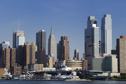 United States, New York, Manhattan, the aircraft carrier USS Intrepid CV-11 at the Intrepid Museum, located on the Pier 86 on the banks of the Hudson River and the Empire State Building