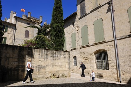 France, Gard, Uzes, listed as town of art and history, Gaston Chauvet street leading to the Duke's castle called the Duche d'Uzes, listed as historical monument, and its Bermonde Tower