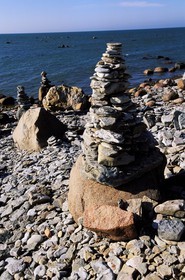 Estonia (Baltic States), Saaremaa Island, Pyramids of flat stones put as lucky charm along the beaches of the southwest
