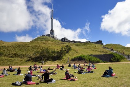 France, Puy de Dome, Parc Naturel Régional des Volcans d'Auvergne (regional nature park of Auvergne volcanoes), Chaine des Puys listed as World heritage by UNESCO, Le Puy de Dôme, yoga class at the top of the highest volcano in the Chaîne des puys