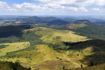 France, Puy de Dome, Parc Naturel Régional des Volcans d'Auvergne (regional nature park of Auvergne volcanoes), the northern part of the Chaine des Puys listed as World heritage by UNESCO, the path leading to the Traversin and the Puy Pariou crater
