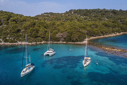 Croatia, Dalmatia, Dalmatian coast, Island of Mljet, National Park of Mljet, anchorage of sailboats in the bay of Polace (aerial view)