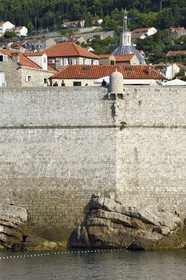 Croatia, Dalmatia, Dalmatian coast, Dubrovnik, Historic Centre listed as World Heritage by UNESCO, the ramparts on the sea side and statue of Saint Blaise protecting the walls under a watchtower