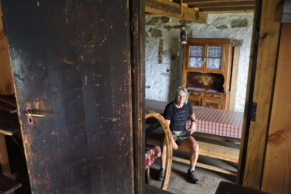 France, Haut Rhin, Ballons des Vosges Regional Natural Park, Storckensohn, La Tete des Perches mountain, the meadow chaume de Gazon vert, Noël Sutter who takes care of the refuge in a former farm