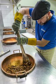 France, Vaucluse, Saint Didier, In the Nougats Silvain workshop,  nougat makers peasant, Charles-Henri Bagnol makes a slab of black nougat, mixture of toasted almonds and the caramelized honey base